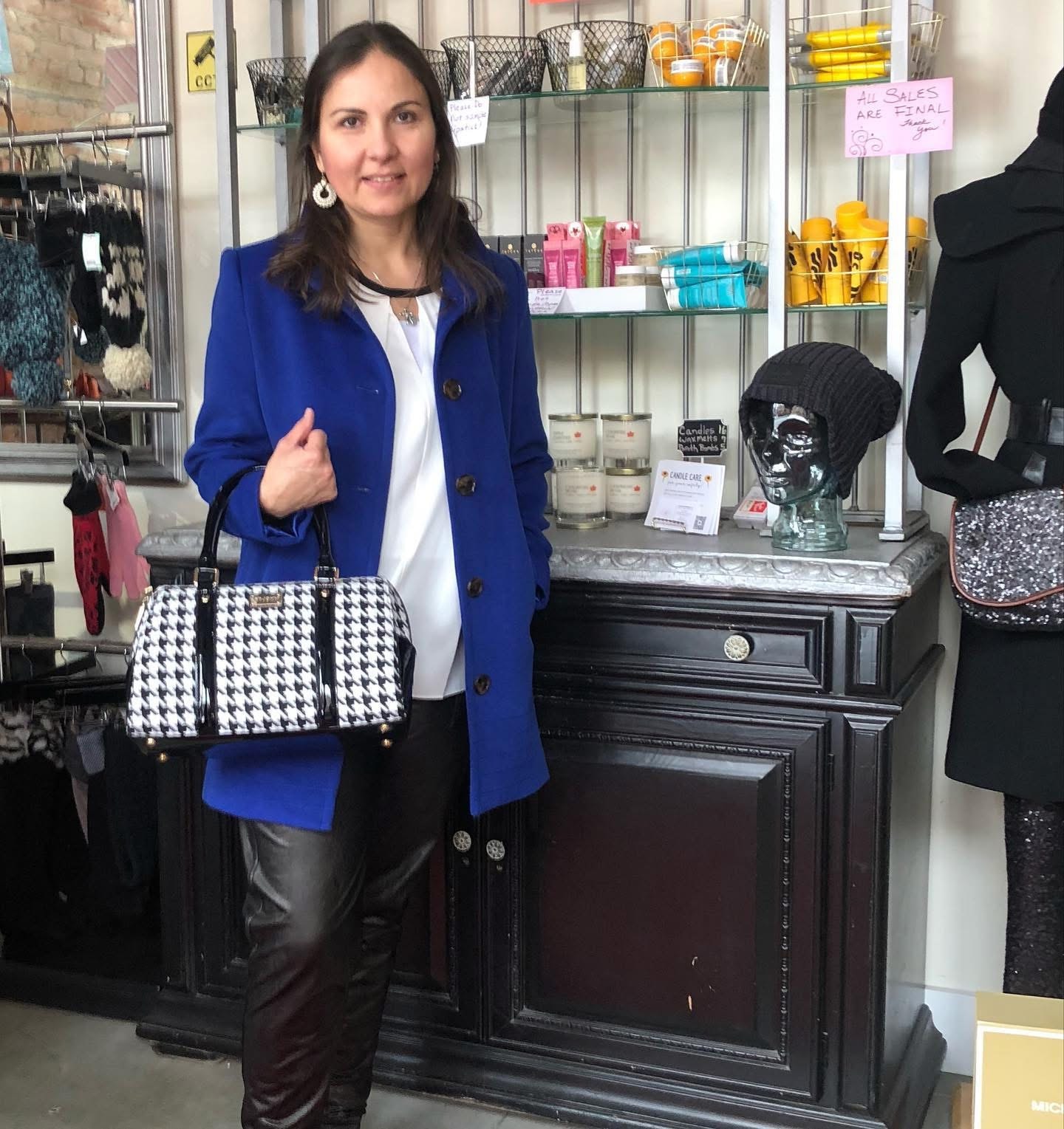 Woman in royal blue blazer with houndstooth bag at Twice Blessed boutique