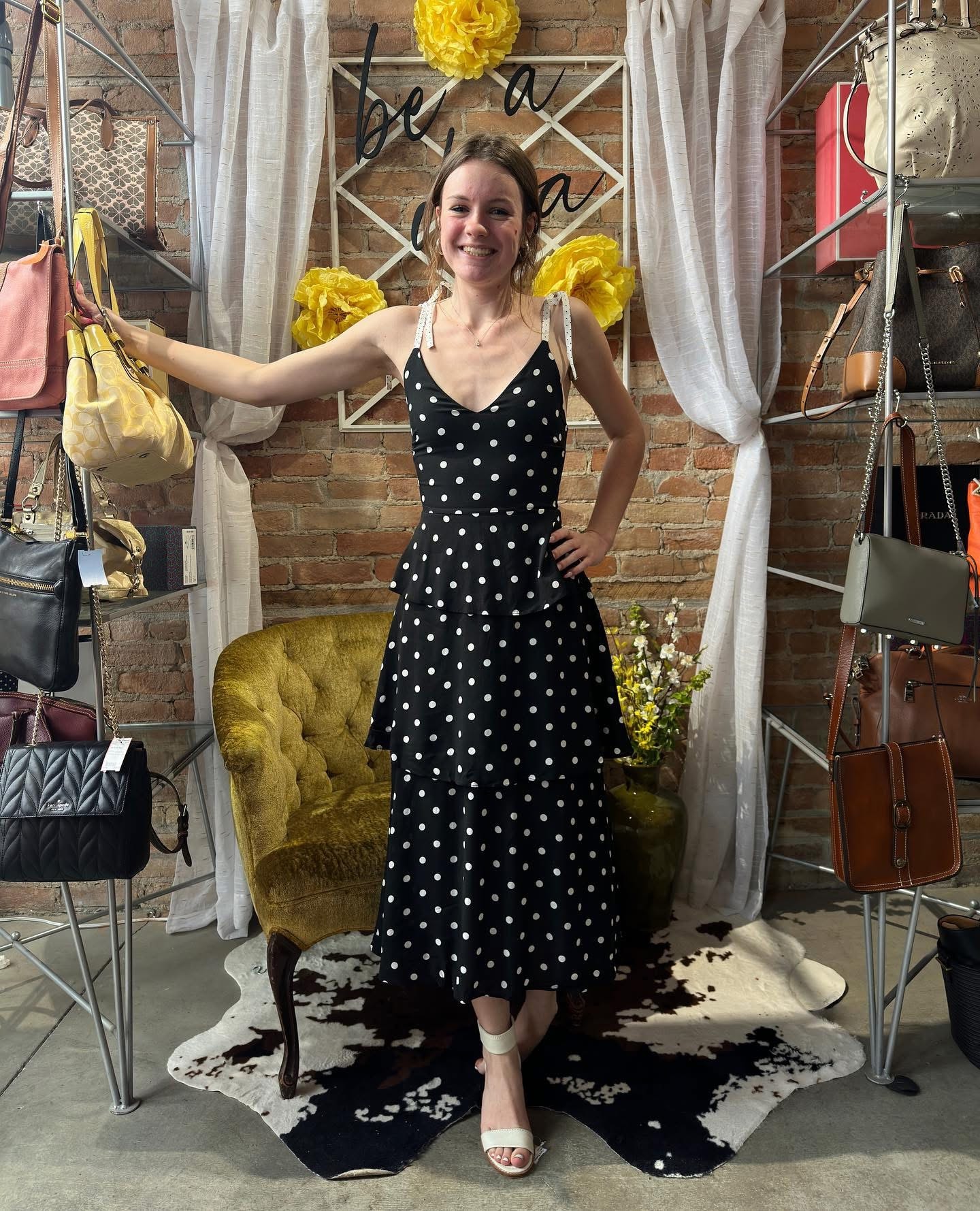 Woman in black and white polka dot dress at Twice Blessed boutique