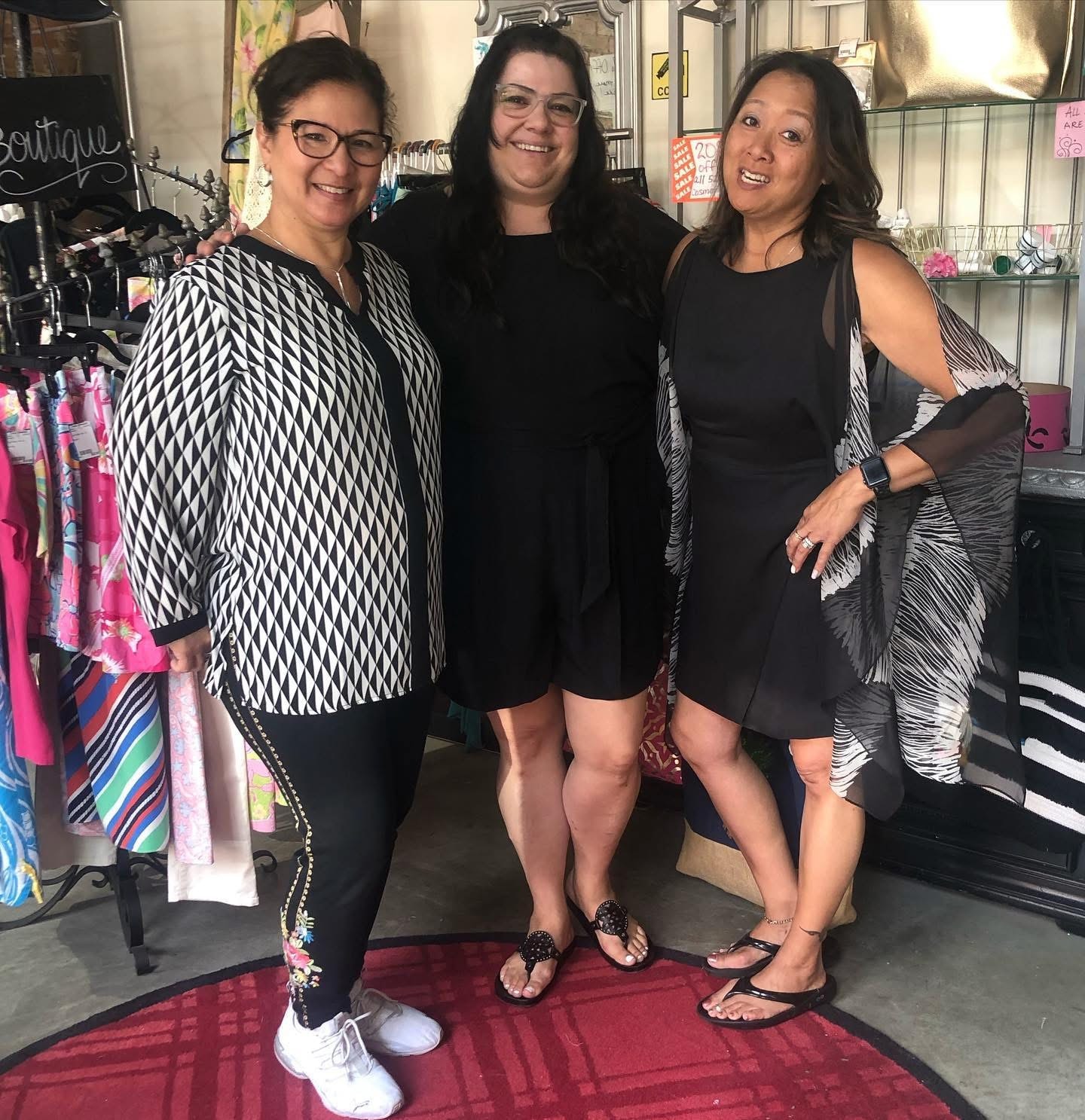 Three friends posing together at Twice Blessed boutique