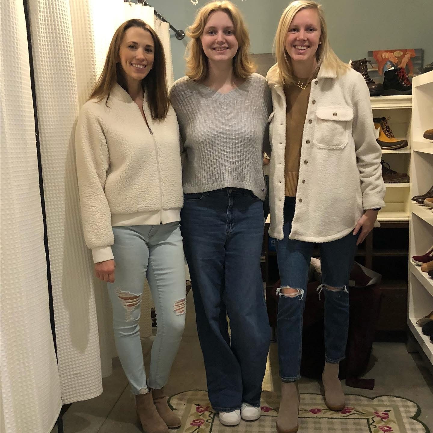 Three women in cozy sweaters and jeans at Twice Blessed boutique