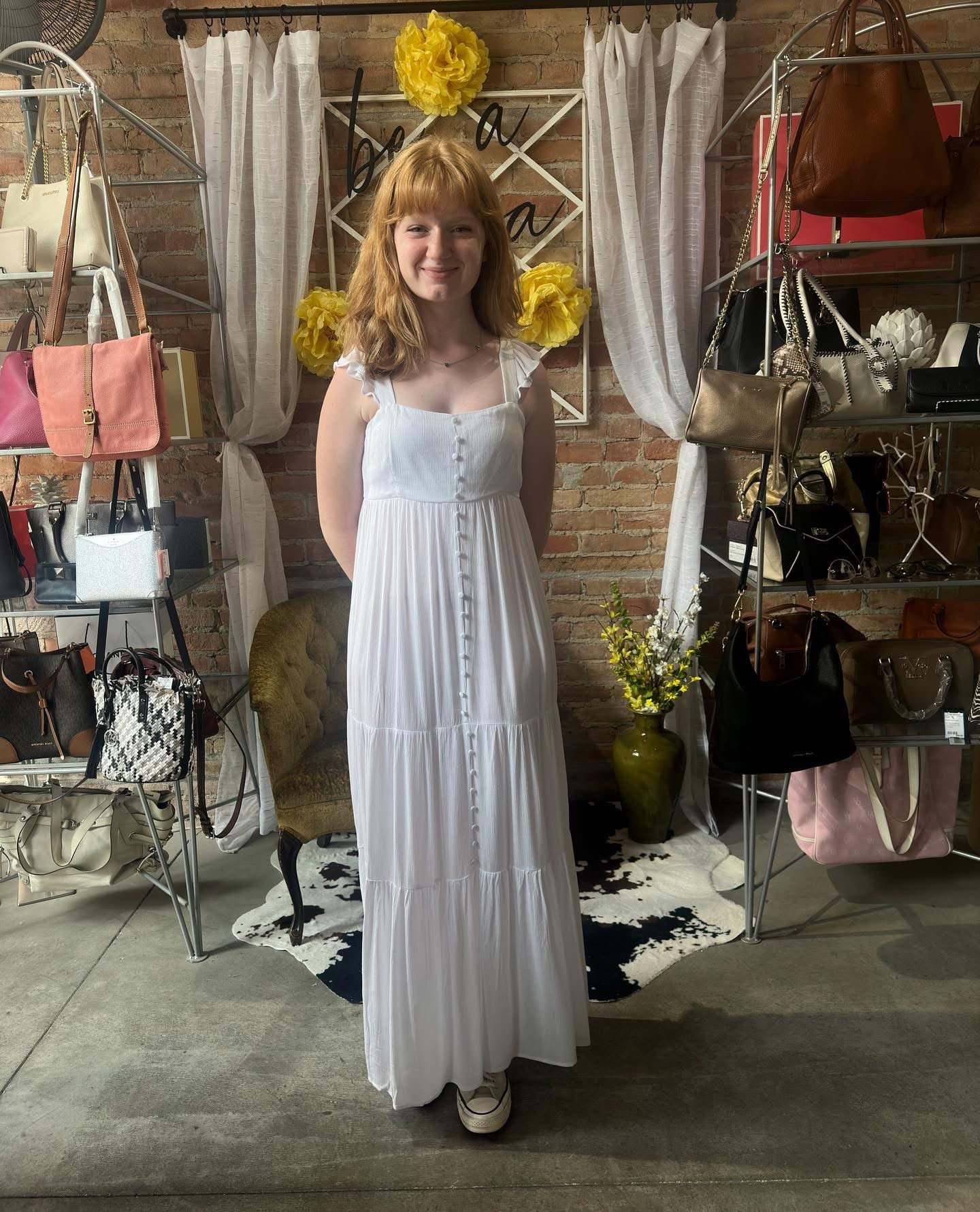 Woman in white tiered maxi dress at Twice Blessed boutique