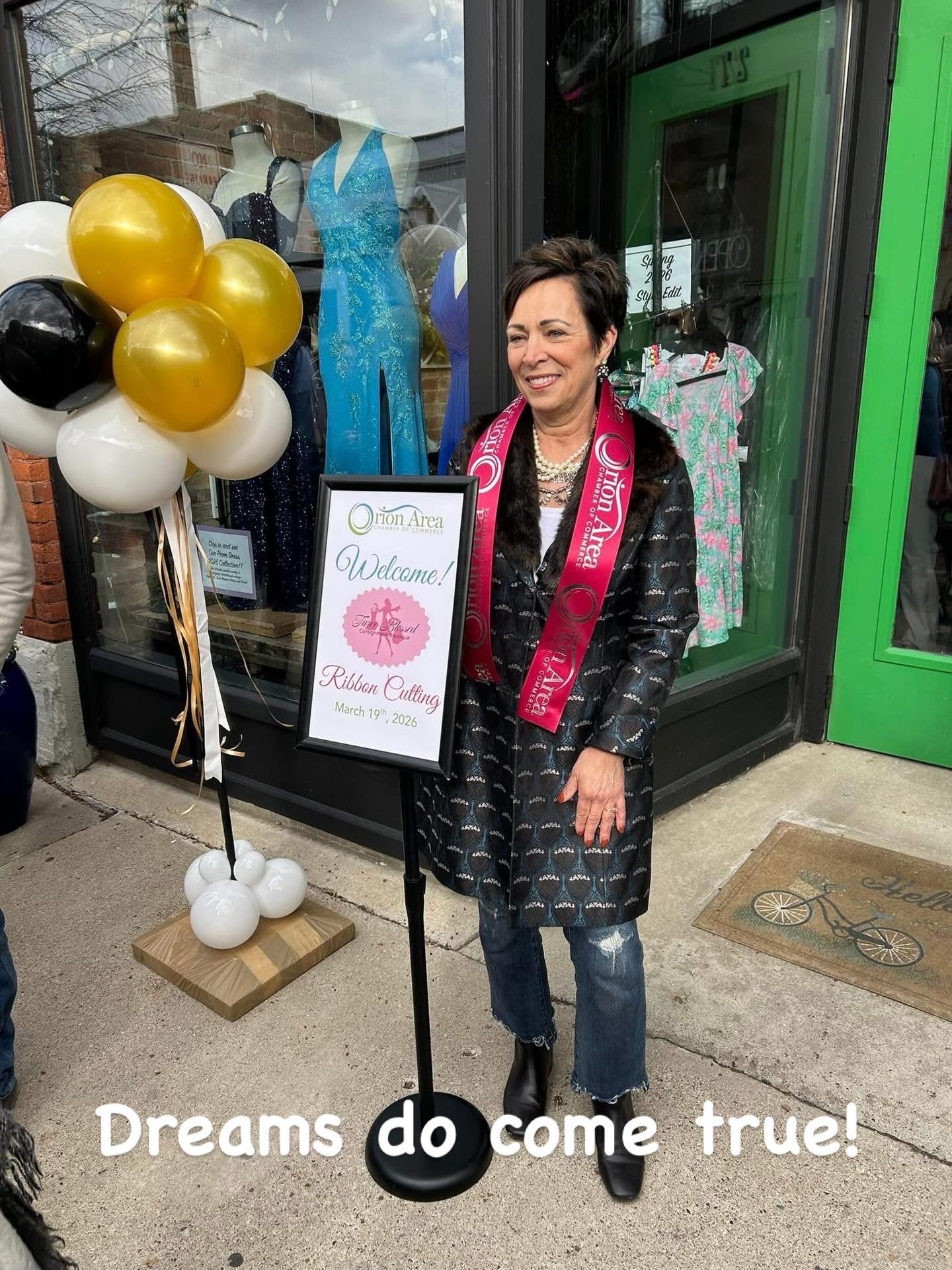 Owner wearing Orion Area Chamber sash outside Twice Blessed — Dreams do come true!