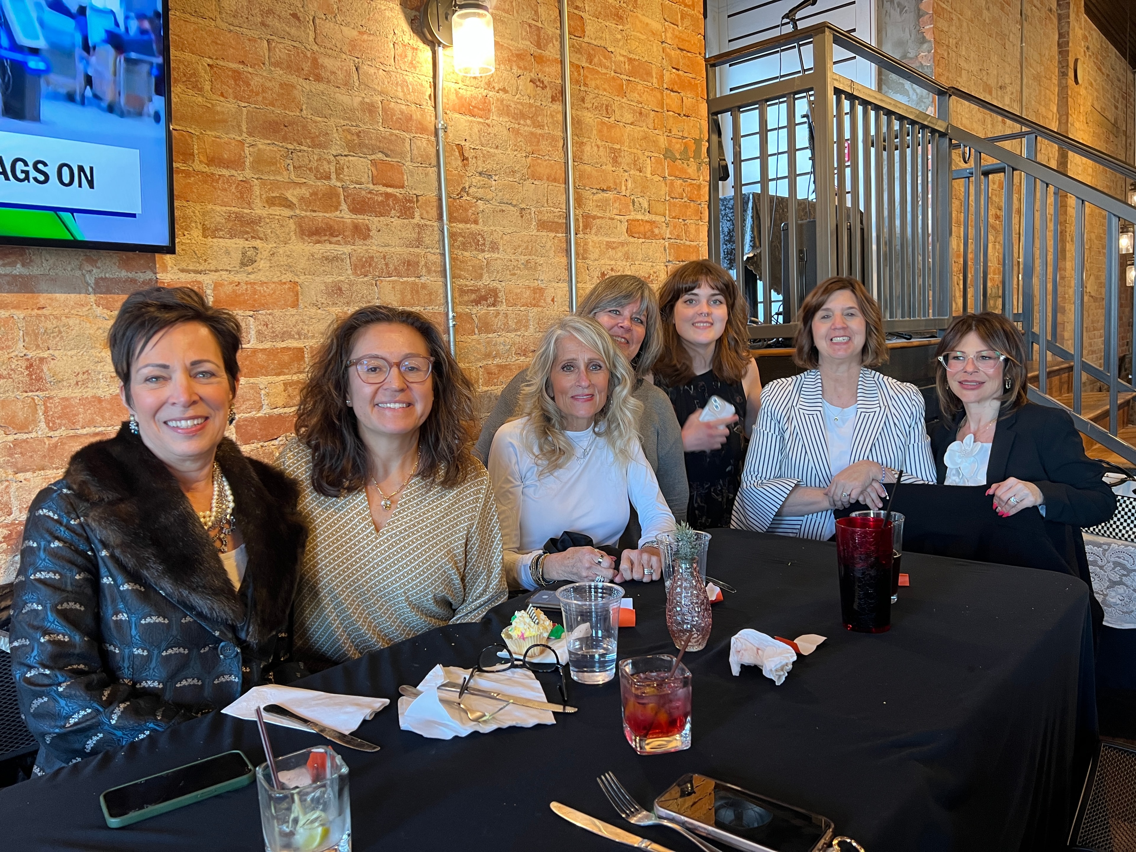 Group of women celebrating at the Twice Blessed Re-Grand Opening dinner party