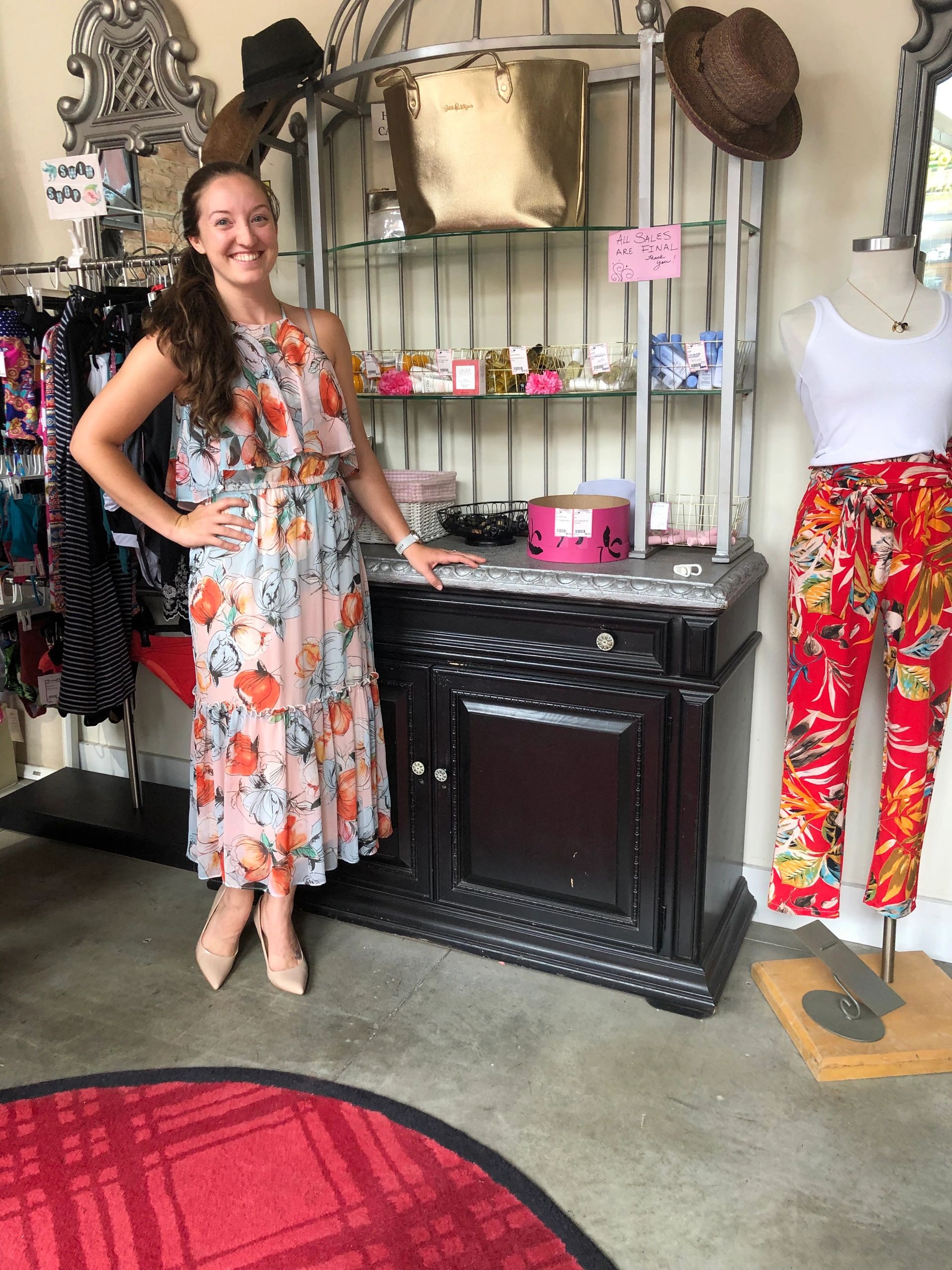 Woman in floral dress at boutique display