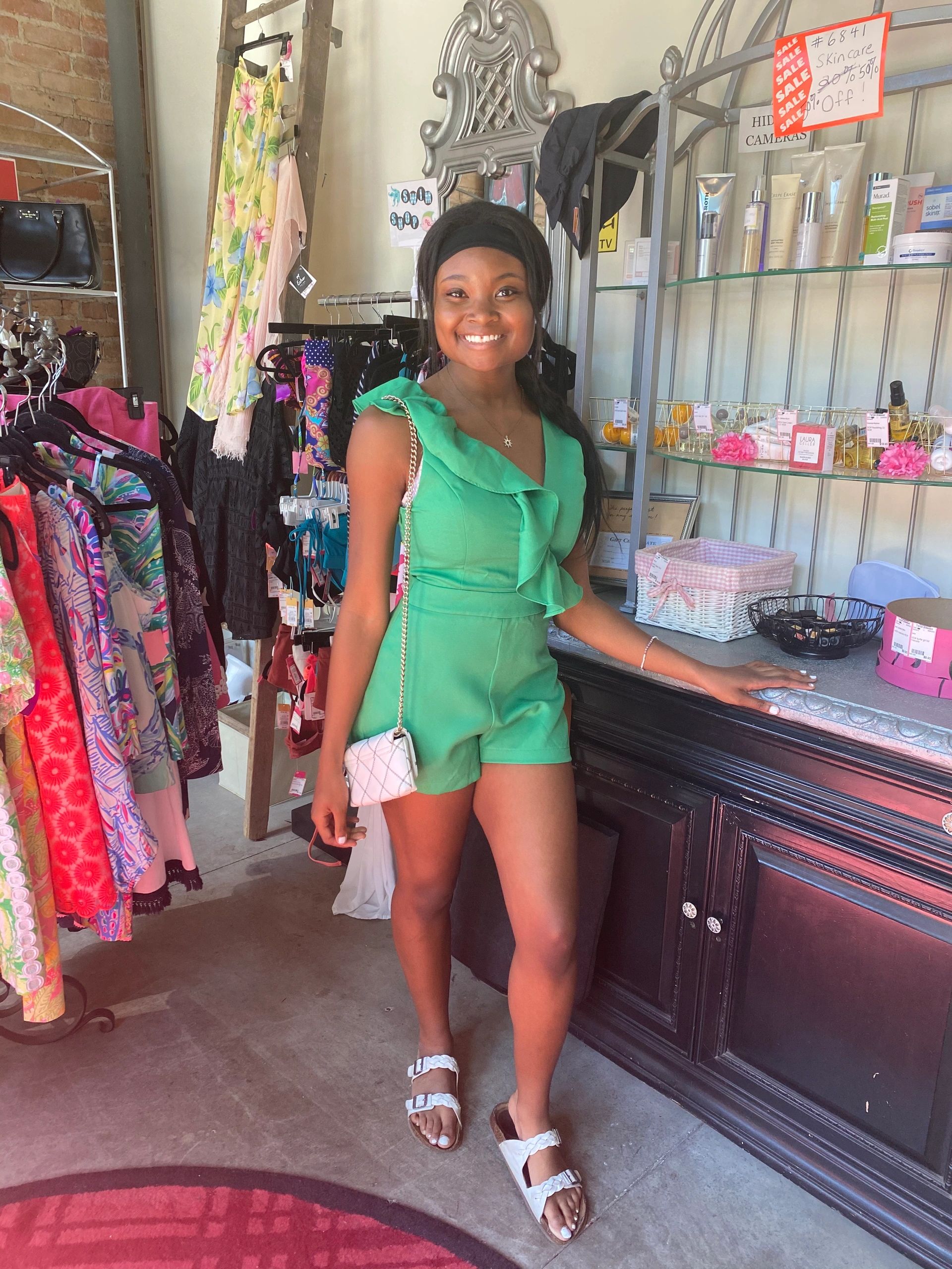 Woman in green romper at Twice Blessed boutique